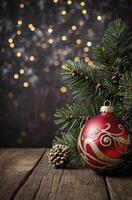 Red Christmas Ornament on Wood with Evergreen Branch and Bokeh Lights photo