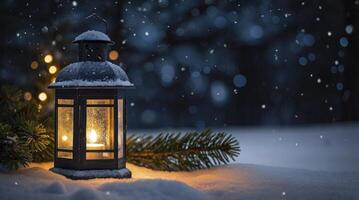 Glowing Lantern and Pine Branch in Winter Snowfall Scene photo