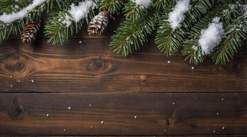 Winter Holiday Arrangement with Snowy Pine Branches and Wooden Background photo