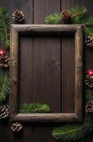 Wooden Frame with Pine Cones and Evergreen Branches on Dark Wood photo