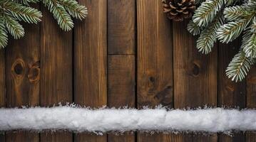 Christmas Fir Branches with Pine Cone and Snow on Wooden Table photo