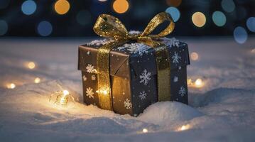 Gift with Golden Ribbon in Snow and Holiday Lights Background photo