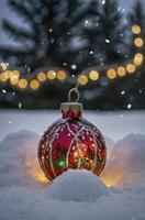 Christmas Ornament in Snow Falling with Decorative Lights and Tree photo