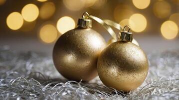Golden Christmas Ornaments with Blurred Lights and Tinsel Background Still Life photo