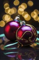 Two Christmas Ornaments on Reflective Surface with Bokeh Lights Background photo
