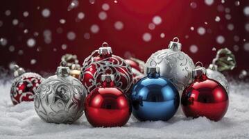 Festive Christmas Ornaments on Snowy Background with Falling Snow Effect photo