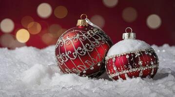Festive Holiday Christmas Ornaments on Snow with Red Background and Bokeh photo