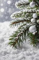 Decorated Christmas Tree Branch with Snow and Silver Ornaments photo