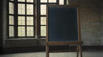 Standing Chalkboard in Vintage Classroom Setting with Window Light photo