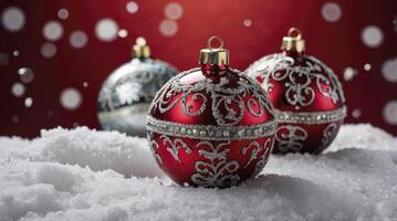 Festive Christmas Ornaments on Snow with Bokeh Lights on Red Background photo