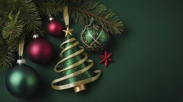 Arrangement of Christmas Tree, Ornaments, and Pine Branch on Green Background photo