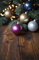 Glittering Christmas Ornaments and Fir Tree Branches on Rustic Wooden Surface photo