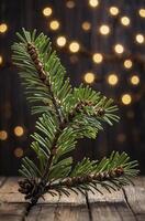 Pine Branch with Cones and Sparkling Lights on a Wooden Background photo