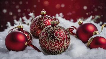 Ornate Christmas Ornaments on Snow with Festive Red Background photo