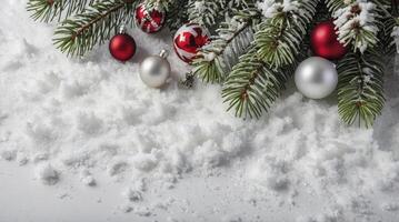 Christmas Ornament and Snowy Fir Tree Branch Festive Holiday Scene photo
