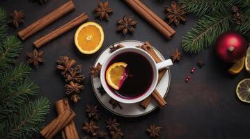 Serving Hot Mulled Wine with Spices and Orange Slice for Winter photo