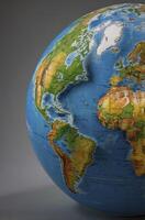 Examining World Globe Displaying Continents and Oceans for Education Purposes photo