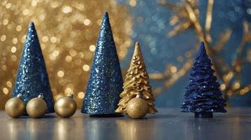 Festive Christmas Tree Ornaments in Gold and Blue with Bokeh Background photo