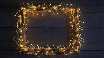Illuminated Twig Frame with Glowing String Lights on Rustic Wood Background photo