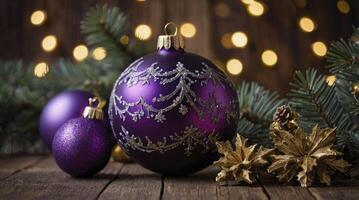 Festive Purple Christmas Ornaments with Bokeh Lights and Pine Branches photo