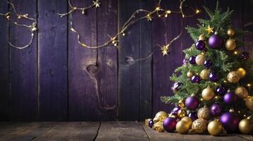Decorated Christmas Tree with Purple and Gold Ornaments on Wooden Table photo
