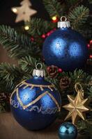 Decorating Christmas Tree with Blue Ornaments and Pine Cones for Holiday photo