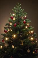 Decorated Christmas Tree with Lights and Ornaments Ready for Holiday Season photo