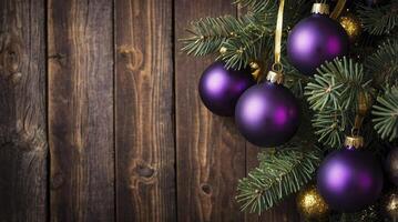 Hanging Purple Christmas Ornaments on a Tree with Rustic Wooden Background photo