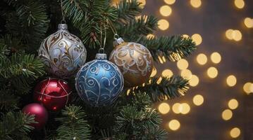 Colorful Christmas Ornaments Hanging on a Decorated Tree with Bokeh Lights photo