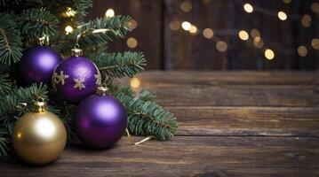 Festive Christmas Ornaments and Evergreen Branches on Rustic Wooden Surface photo