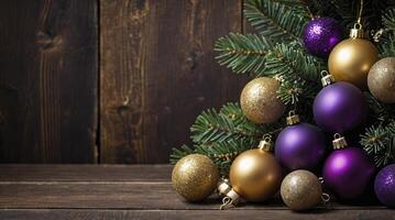 Decorating Christmas Tree with Gold and Purple Baubles on Wood Surface photo