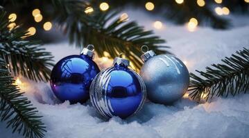 Festive Christmas Ornaments on Snow with Pine Branches and Twinkle Lights photo