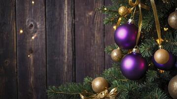 Decorated Christmas Tree with Purple and Gold Ornaments Against Wood Backdrop photo