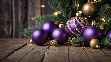 Festive Purple and Gold Christmas Ornaments on Rustic Wooden Surface photo