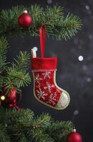 Hanging Christmas Stocking on Tree with Ornaments for Festive Decor photo