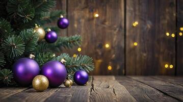 Christmas Tree with Purple and Gold Ornaments on Rustic Wood Surface photo