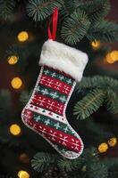 Hanging Christmas Stocking with Snowflake Pattern on Tree Branch Decoration photo