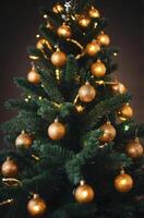 Decorating Christmas Tree with Gold Ornaments and Lights for Holiday Season photo