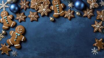 Gingerbread Cookies and Christmas Ornaments on Blue Background for Holiday photo
