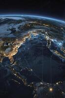 Earth From Space at Night Showing City Lights and Navigation Lines photo