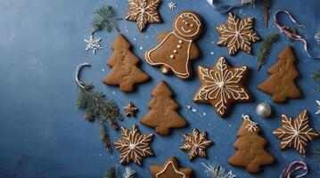 Festive Christmas Gingerbread Cookies Arranged on Blue Background for Holiday Season photo