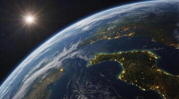 Earth View From Space Showing City Lights and Sun Star photo