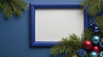 Festive Blue Frame with Christmas Ornaments and Pine Branches Arrangement photo