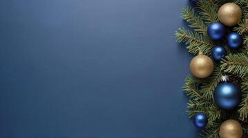 Christmas Background with Blue Ornaments and Pine Branch on Navy Blue photo