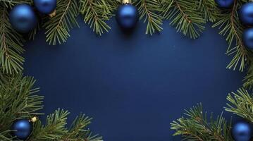 Christmas Ornament and Evergreen Border Against Blue Backdrop for Holiday Design photo