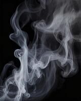 Swirling White Smoke on Black Background Creates Abstract and Ethereal Effect photo
