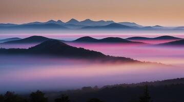 Majestic Mountain Range at Dawn with Fog and Colorful Light photo