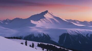 Snowy Mountain Range at Sunset with Pink Sky and Evergreen Trees photo