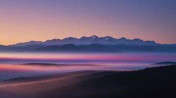 Majestic Mountain Range Landscape with Morning Haze and Gentle Light photo