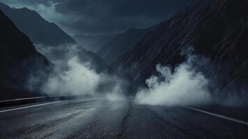 Driving Through Misty Mountain Pass Road with Ominous Atmospheric Conditions photo